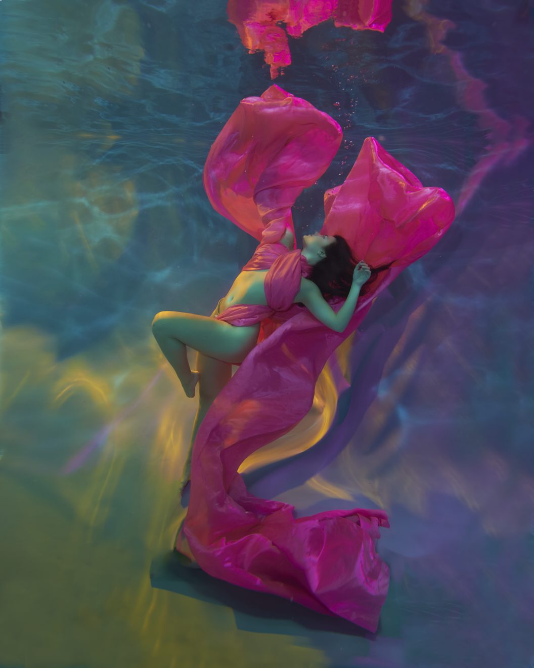Stunning underwater image of model in satin