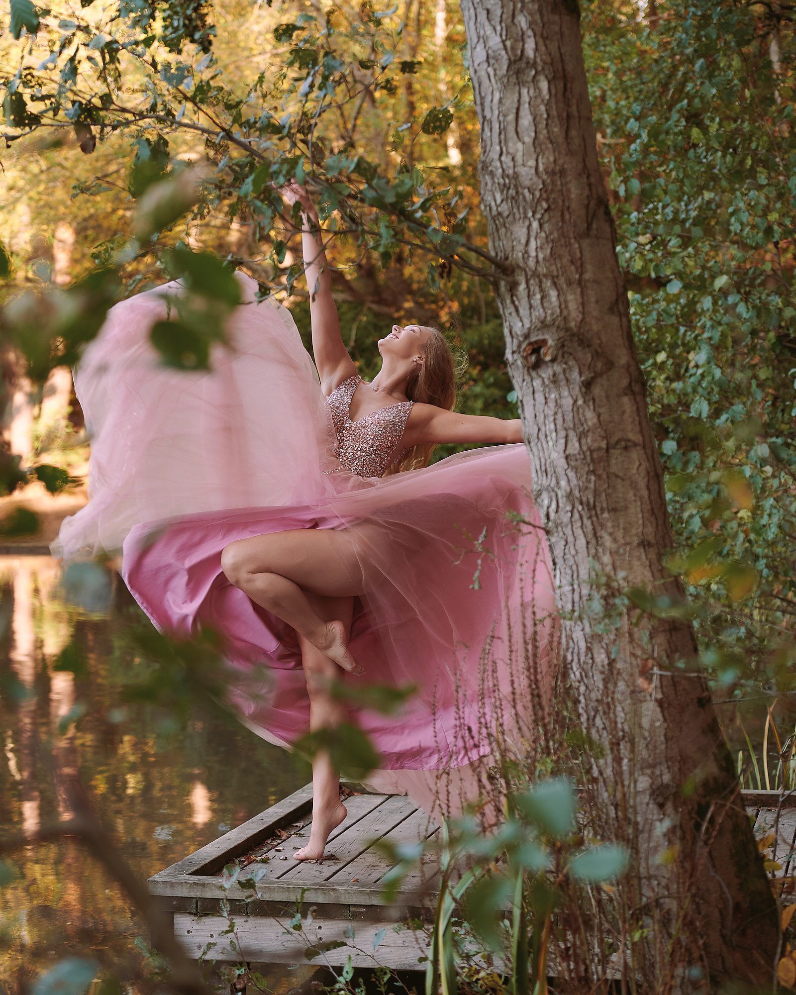 Dancer by a lake in a surrey wood
