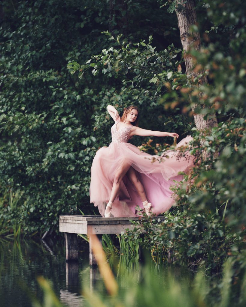 Ellie Higton Surrey Dancer on a lake in a flowing dress