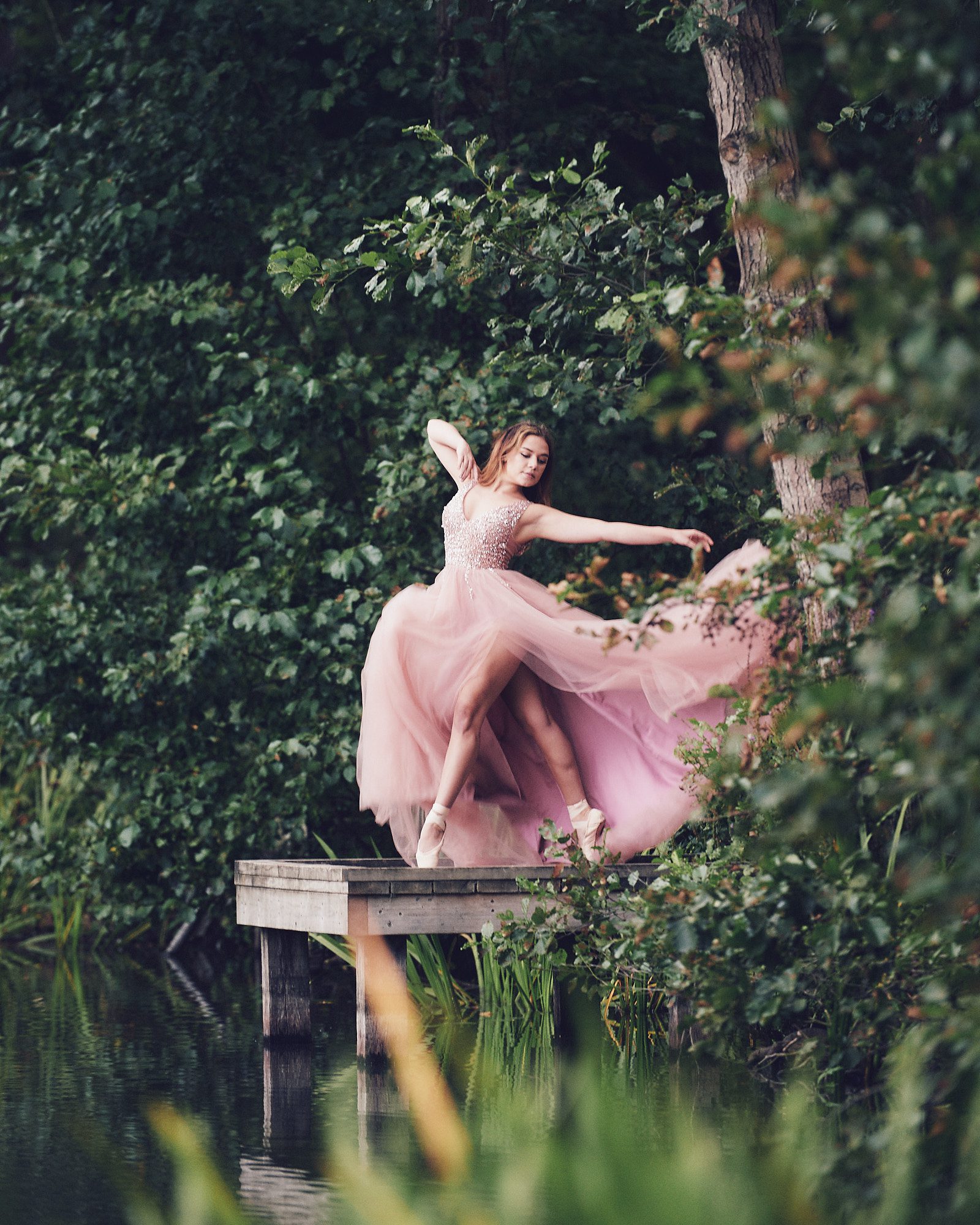 Surrey Dancer on a lake in a flowing dress