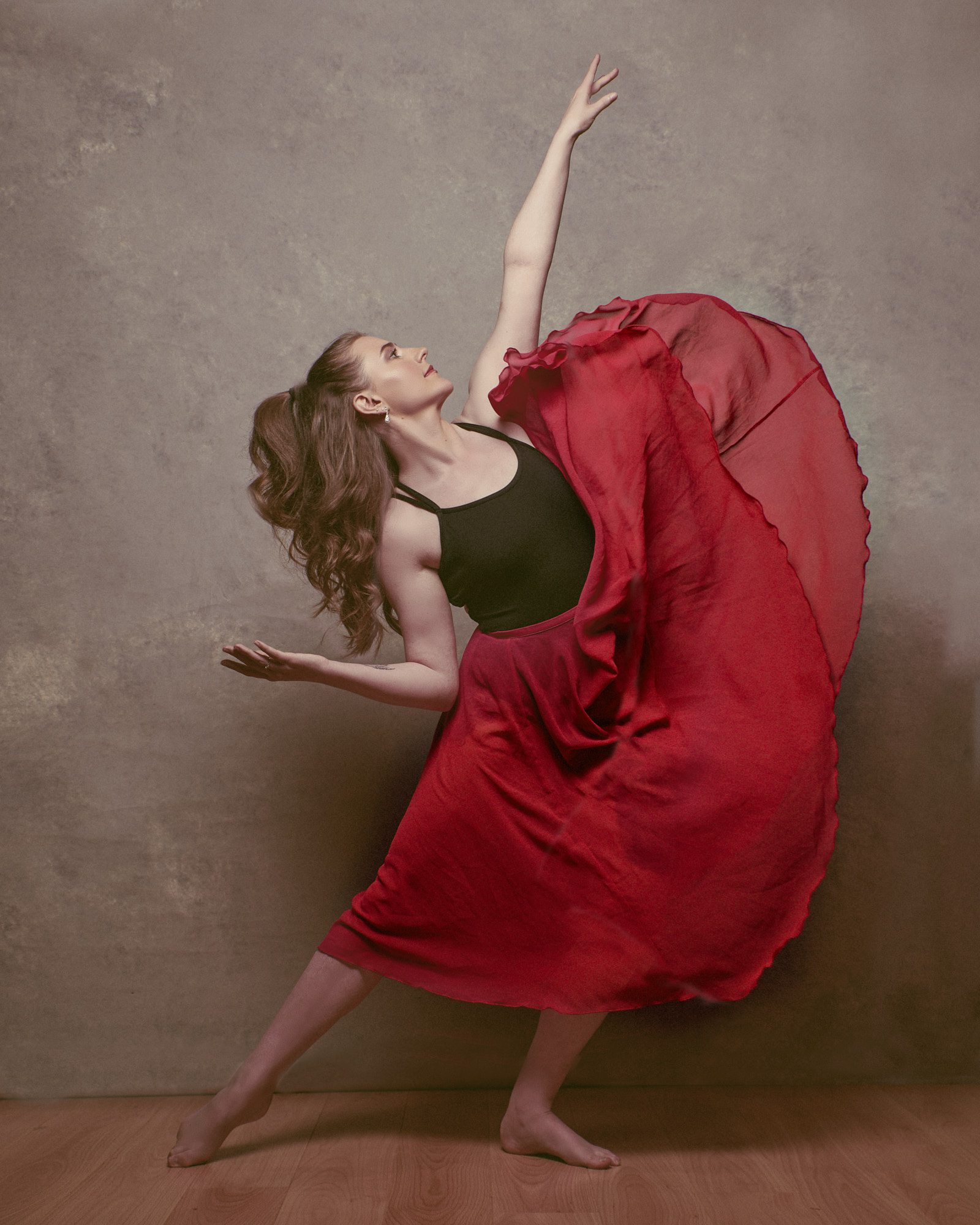 Dancer in red dress in a Surrey studio